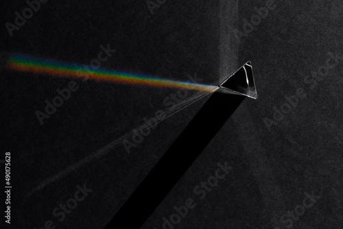 Top View of Prism Refracting Light to Create Shadows and Rainbow
