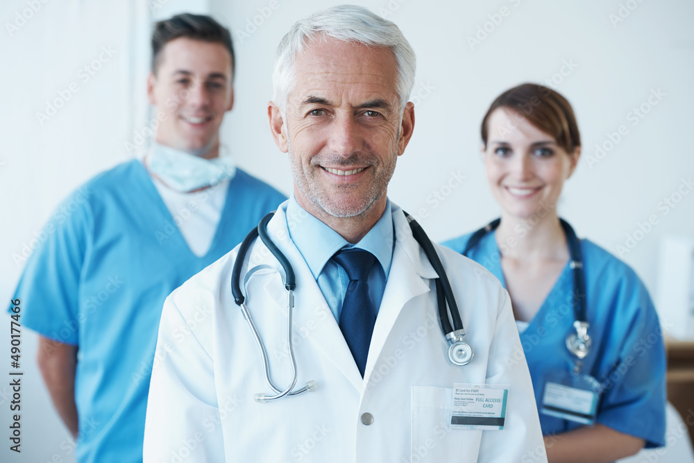 Ready to take on the challenge of saving lives. A group of healthcare workers standing and smiling at the camera. Ready to take on the challenge of saving lives. A group of healthcare workers standing and smiling at the camera.