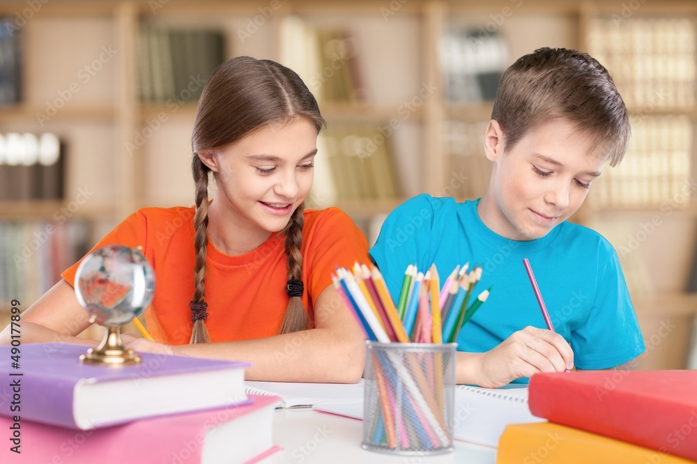 Distance education. Smiling child studying online at home,