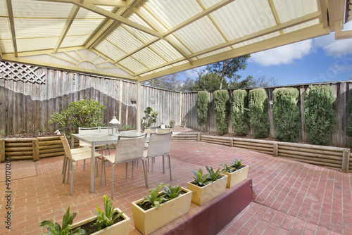 Photography Modern terrace with dining table and chairs