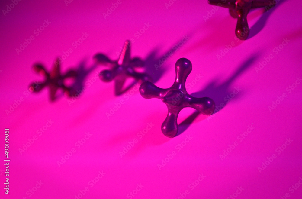Metal Playing Jacks | Playing Jacks Isolated in Pink | Playing Jacks Close Up Metal Playing Jacks | Playing Jacks Isolated in Pink | Playing Jacks Close Up