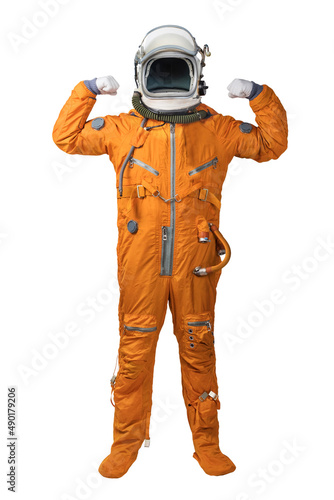 Astronaut wearing orange spacesuit and helmet showing biceps gesture isolated on white background. Unrecognizable cosmonaut with raised hands showing biceps isolated on white background