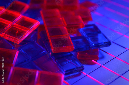 Red and Blue Plastic Pieces on a Grid | Plastic Tiles | Plastic Pieces | Red and Blue Lighting
