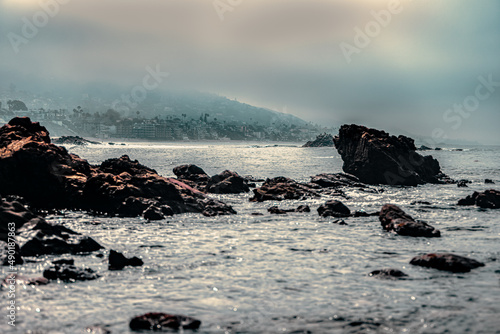 Tranquil senery of the rocky coast of the ocean at dawn photo
