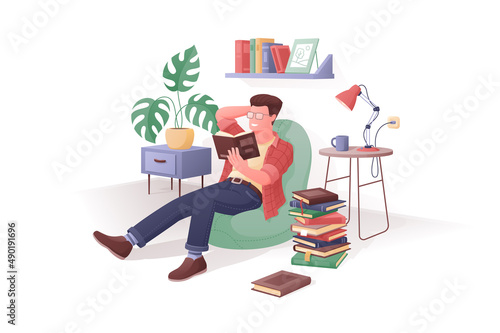 Man reading book at home, literacy day