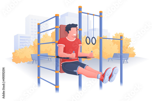 Street workout on sports ground in park