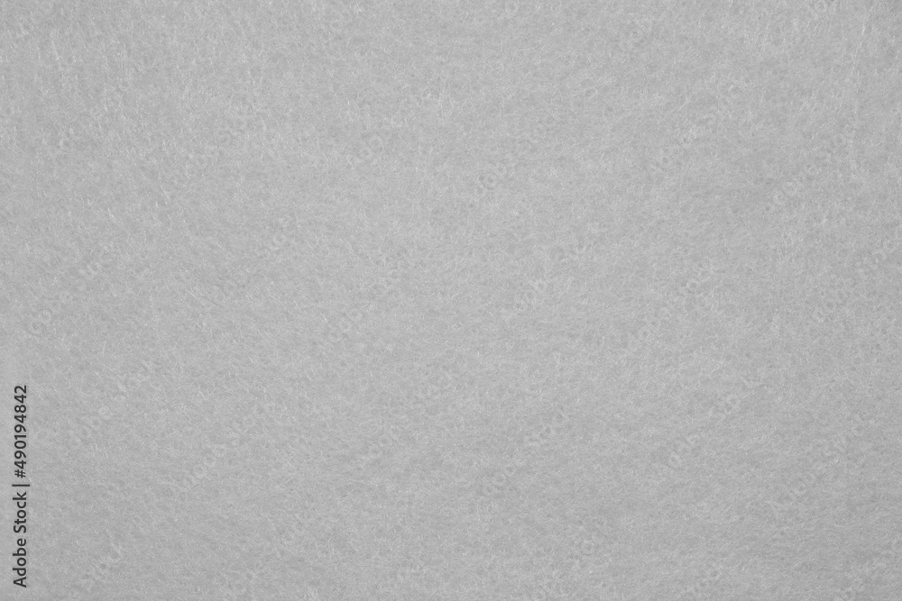 Horizontal light grey felt material texture background. Close up. Horizontal light grey felt material texture background. Close up.