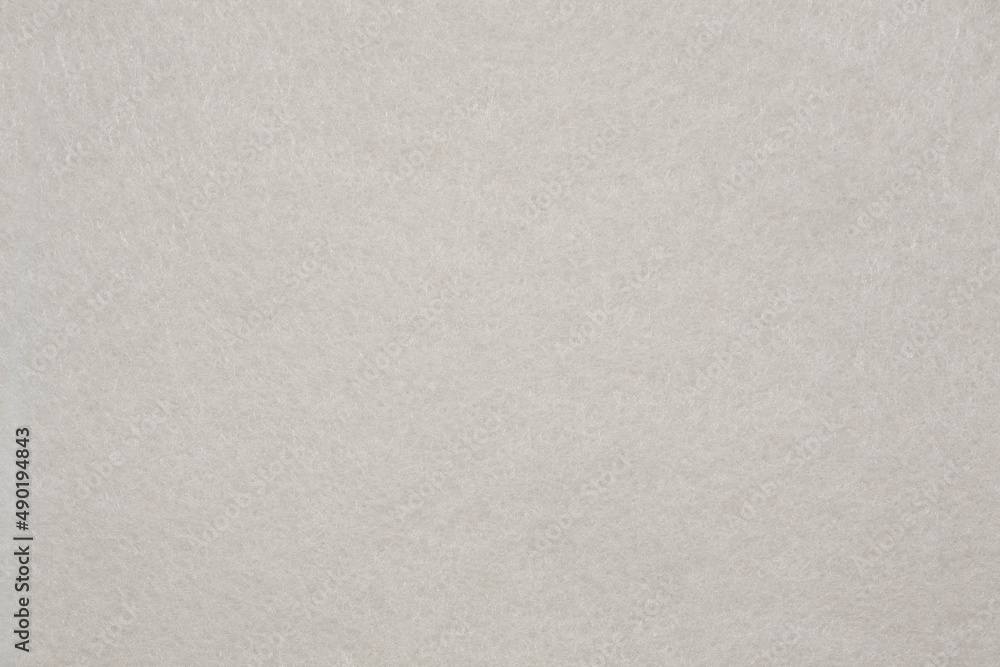 Horizontal beige felt material texture background. Close up. Horizontal beige felt material texture background. Close up.