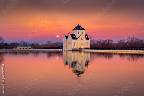 Beautiful shot of a historic building on a lake shore at sunset in Louisville, Kentucky photo