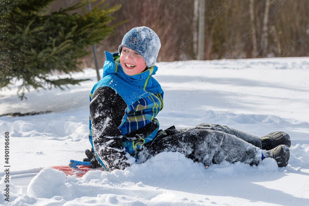 Snow-covered Boy Playing in the Snow Snow-covered Boy Playing in the Snow