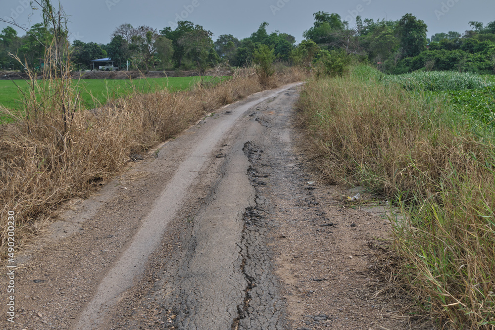 Asphalt surface on the street was demolished due to poor construction.. Asphalt surface on the street was demolished due to poor construction..