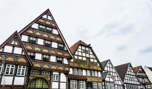 Scenic view of old-style buildings in a row in Bad Salzuflen, Germany on a cloudy sky photo