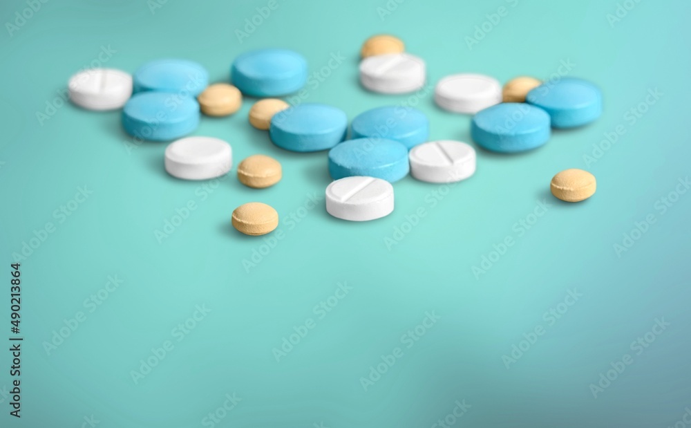 Antibiotic capsule pills on background. Prescription drugs. Colorful capsule pills.