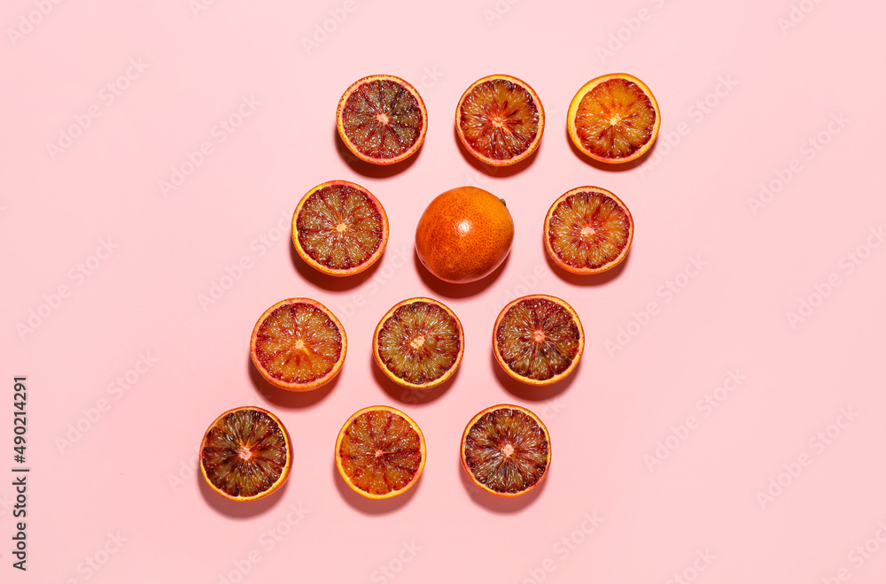 Many ripe sicilian oranges on pink background, flat lay Many ripe sicilian oranges on pink background, flat lay