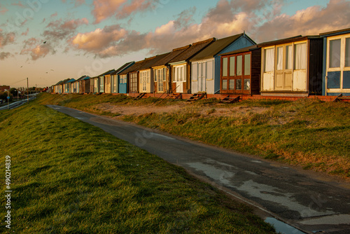 Colorful beach huts on Sandilands beach in Lincolnshire photo