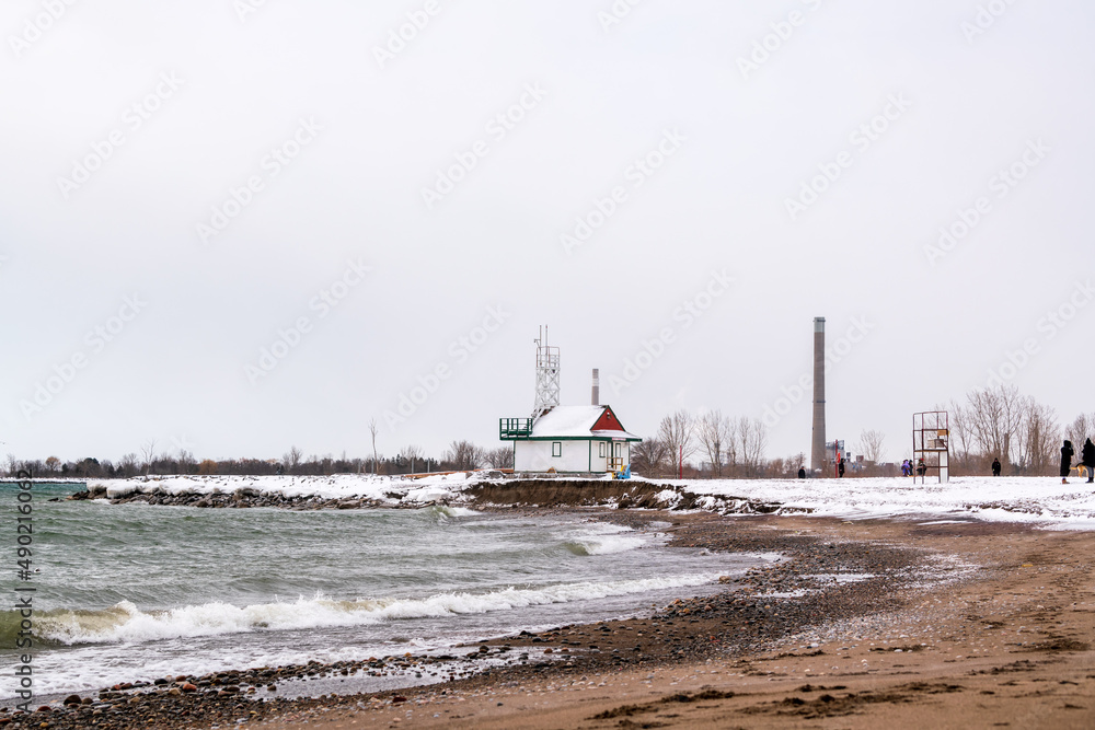 A snowy winters day  along the shoreline of Toronto's Beaches neighbourhood, a park area popular with dog walkers.