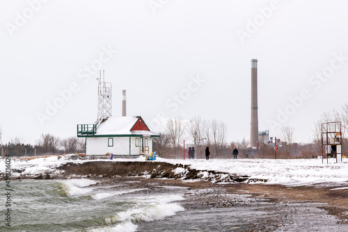 A snowy winters day along the shoreline of Toronto's Beaches neighbourhood, a park area popular with dog walkers.