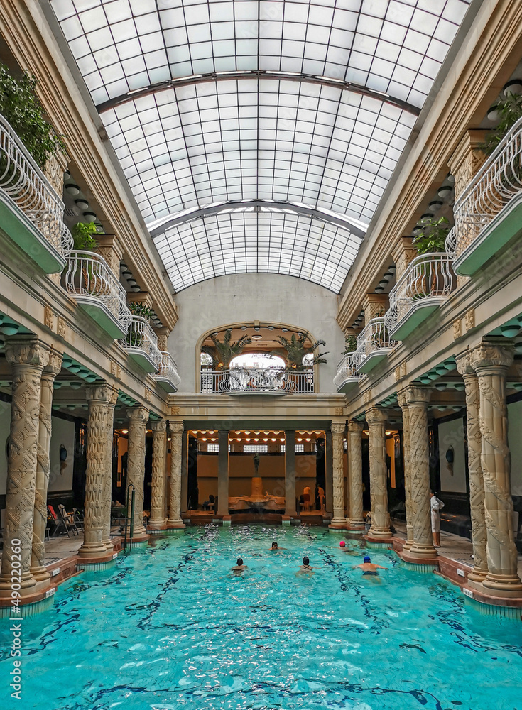 Fototapeta premium Group of people swimming in an indoor pool at Gellert spa in Budapest, Hungary