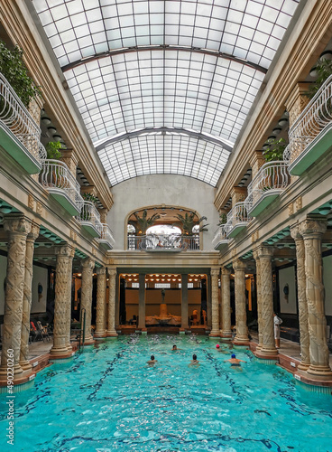 Group of people swimming in an indoor pool at Gellert spa in Budapest, Hungary photo