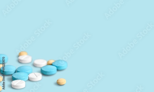 Antibiotic capsule pills on background. Prescription drugs. Colorful capsule pills.