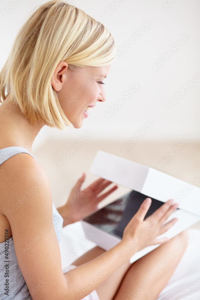 A present for me. A beautiful young woman opening a box. A present for me. A beautiful young woman opening a box.