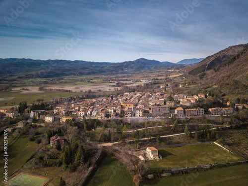 Bird's eye view of the medieval village of Costacciaro at the foot of Mount Cucco in Italy photo