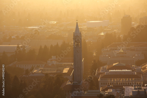 Aerial view pf the Sather Tower with a bell tower with clocks in California at sunset photo