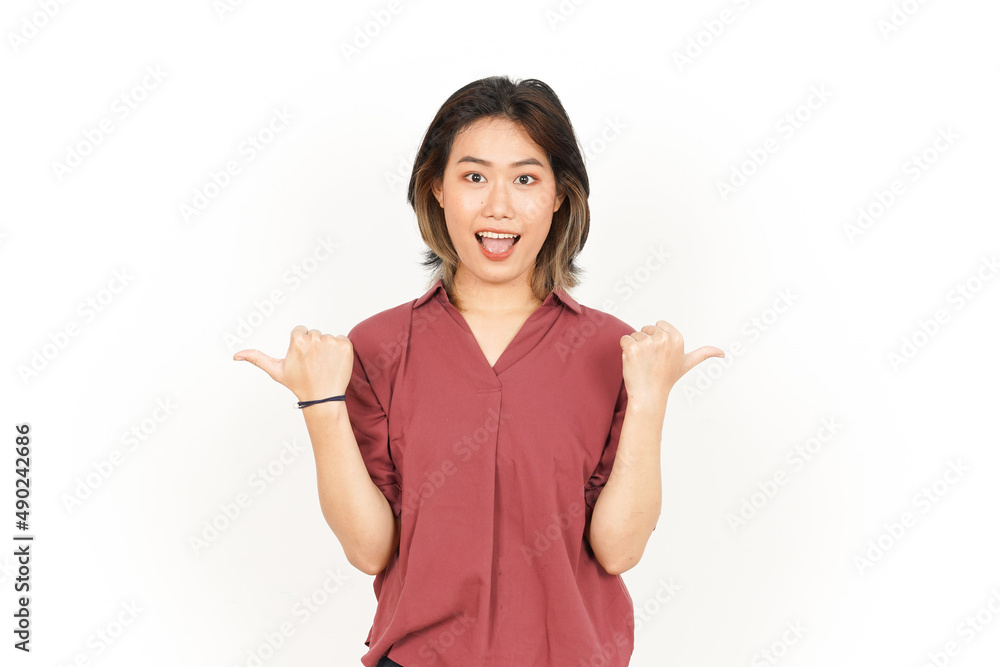 Showing and Pointing Two Product With Thumbs Of Beautiful Asian Woman Isolated On White Background Showing and Pointing Two Product With Thumbs Of Beautiful Asian Woman Isolated On White Background