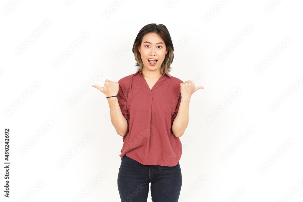 Showing and Pointing Two Product With Thumbs Of Beautiful Asian Woman Isolated On White Background