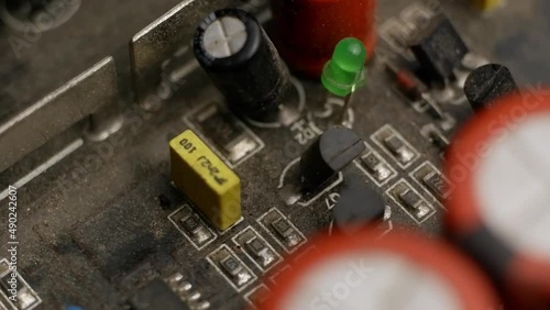 Rotation the electrical circuit of the audio amplifier. Small items and LED.