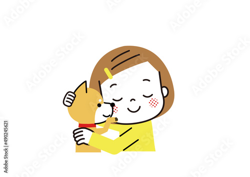 柴犬を抱っこして幸せそうに眼を閉じる女の子