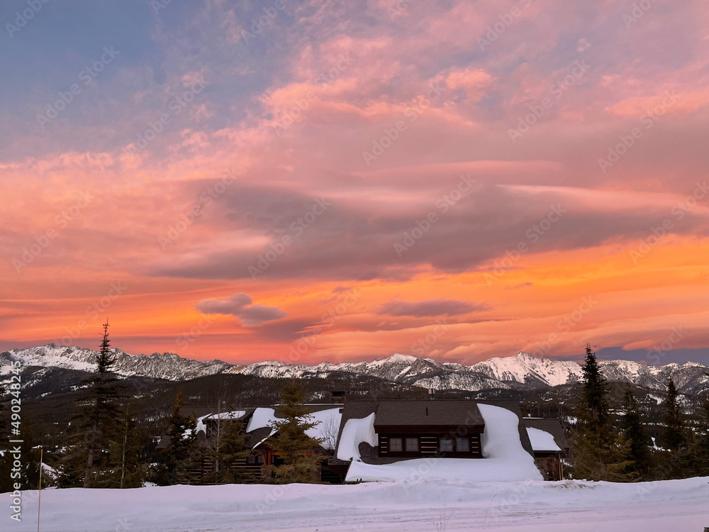 Dramatic and colourful sunset skies over Gallatin Peak as seen from Big Sky, Montana on a winter day Dramatic and colourful sunset skies over Gallatin Peak as seen from Big Sky, Montana on a winter day