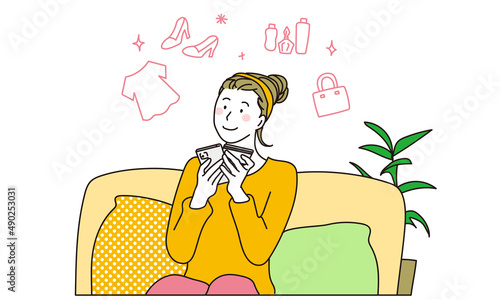 スマートフォンでオンラインショッピングをする女性