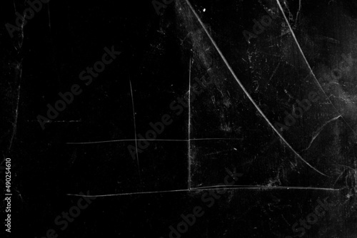 white scratches with spotsisolated on black background photo