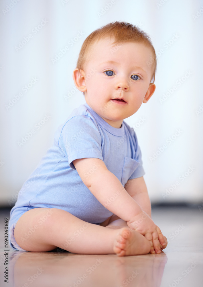 Growing up in the safety of home. Shot of an adorable baby boy in his home. Growing up in the safety of home. Shot of an adorable baby boy in his home.