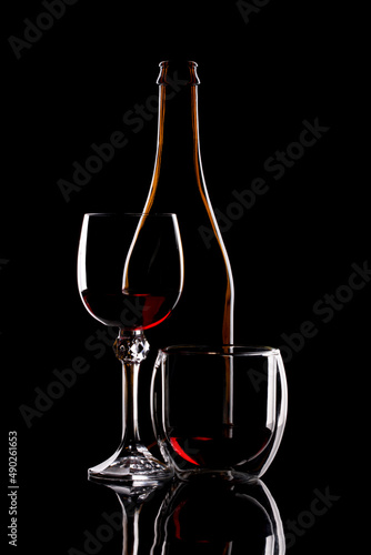 Still life with glass objects on a black background