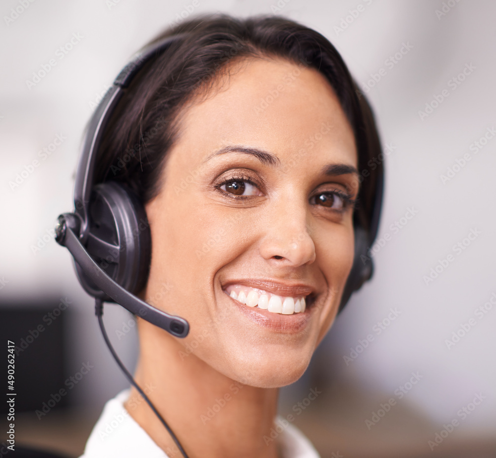Ready to solve your problem. Portrait of an attractive young office worker wearing a headset. Ready to solve your problem. Portrait of an attractive young office worker wearing a headset.