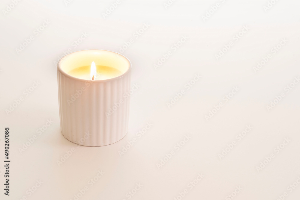 Closeup of a candle in white background with copy space Closeup of a candle in white background with copy space