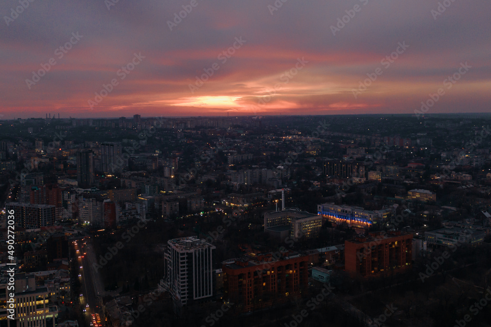 Pink sunset over the city of Dnipro. Drone photography. Warm evening city