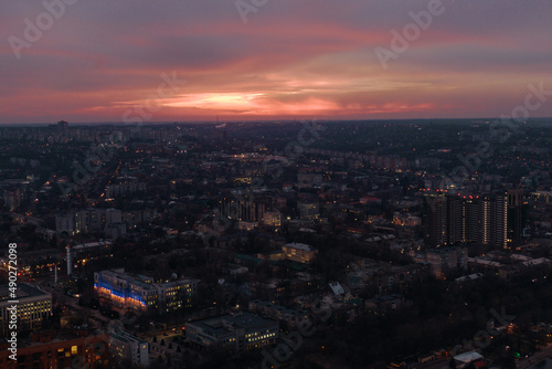 Pink sunset over the city of Dnipro. Drone photography. Warm evening city