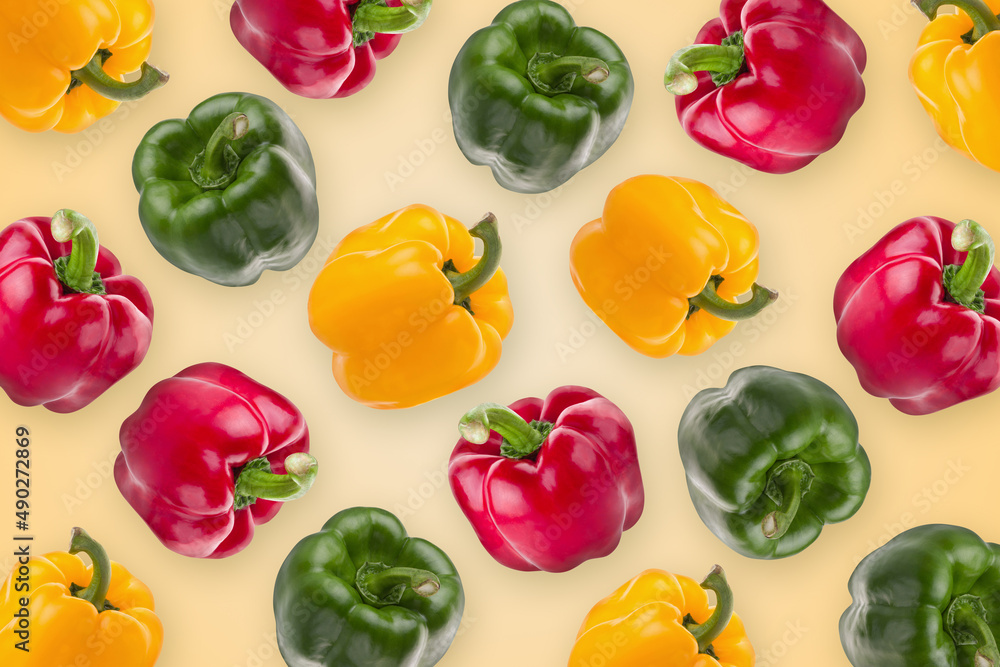 yellow red and green pepper on a wallpaper background.