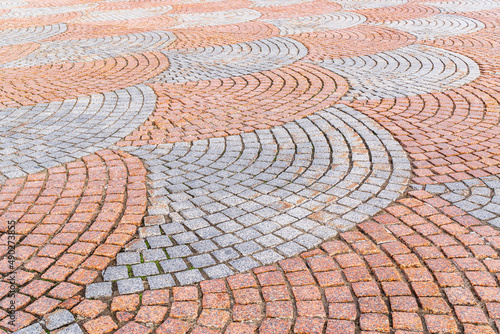 Cobbled pavement of red and gray cobblestone