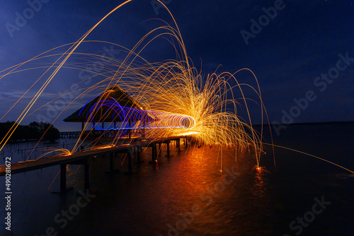 Rotating burning steel wool  People play fireworks in celebrations 