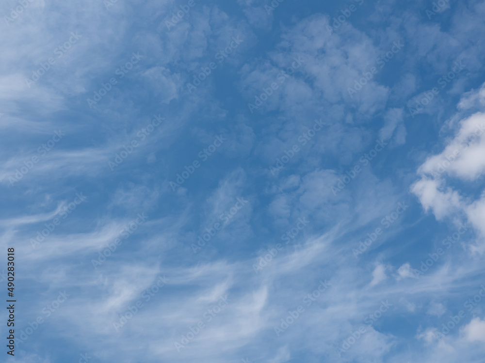 White clouds in a blue sky. Bright sky background. Sky and clouds wallpaper. White clouds in a blue sky. Bright sky background. Sky and clouds wallpaper.