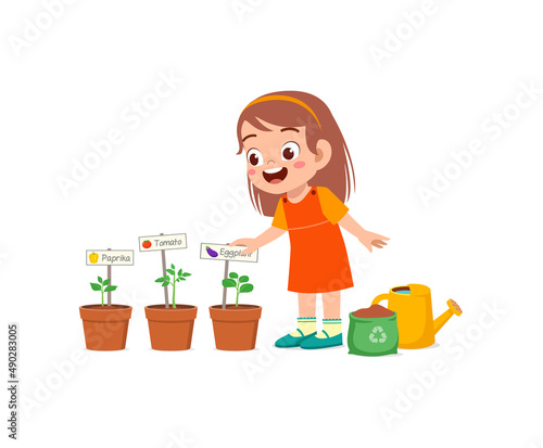 cute little girl take care of vegetable plant