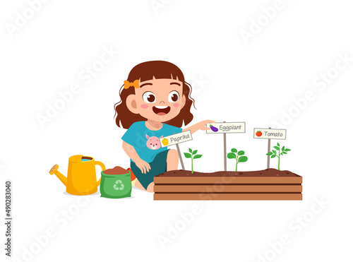 cute little girl take care of vegetable plant
