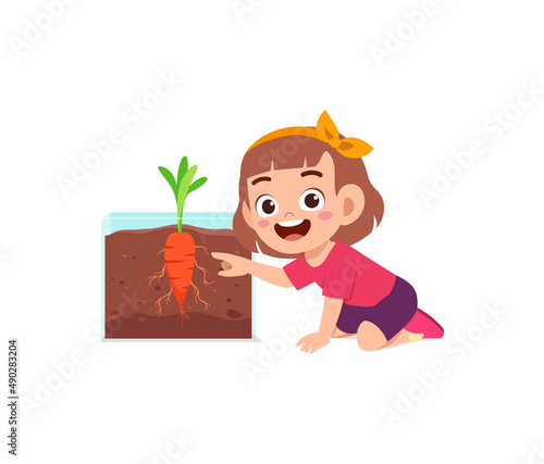 little girl observe plant growing in garden