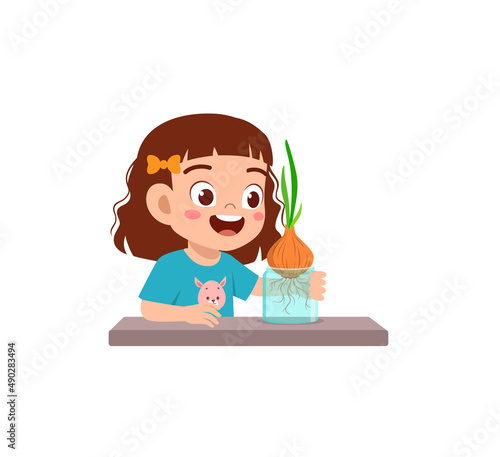 little girl observe plant growing in garden