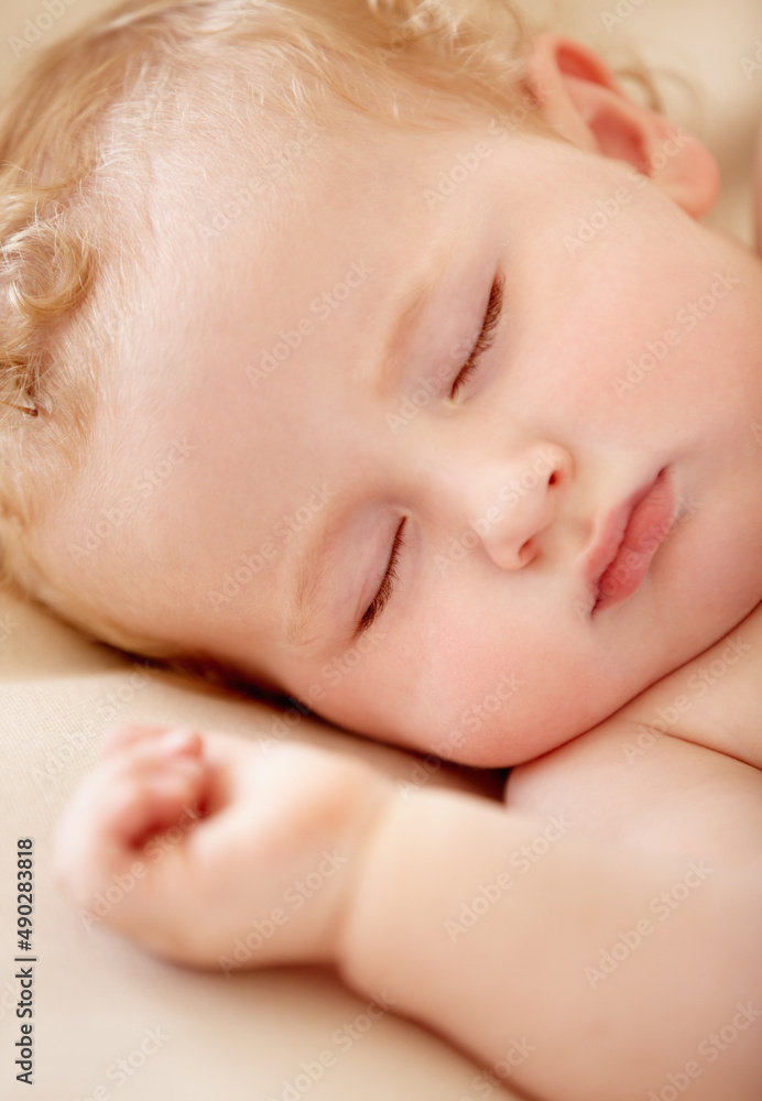 Napping soundly. Tiny baby boy lying fast asleep. Napping soundly. Tiny baby boy lying fast asleep.