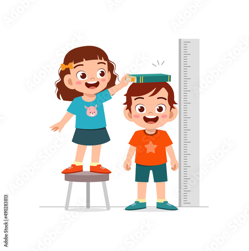 boy and girl measure height for grow progress